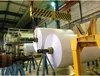 Industrial setting with large rolls of paper. Náhled obrázku produktu