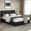 A bedroom scene with a black upholstered bed. Produktbild-Vorschau