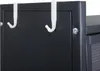 A close-up view of two white hooks hanging over the edge of a black cabinet. Anteprima dell’immagine prodotto