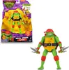 A Teenage Mutant Ninja Turtle action figure in its packaging and displayed separately. Produktbild-Vorschau