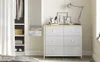 A bedroom dresser with six drawers and a lamp on top, next to a closet and a full-length mirror. Náhled obrázku produktu