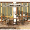 An outdoor dining set with a large umbrella on a wooden deck. Produktbild-Vorschau