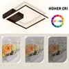 A modern square LED ceiling light with a dark frame and a central dark square element. Below are three images of a bouquet of flowers, each labeled with a different CRI value (80, 70, and 60) to demonstrate color rendering. Voir les images du produit