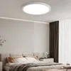 A modern bedroom with a bed, nightstand, and curtains, featuring a ceiling light. Produktbild-Vorschau