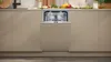 A dishwasher is shown integrated into a kitchen cabinet. Produktbild-Vorschau