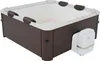 A square hot tub with a dark brown wooden exterior and a white interior, shown with a white pump unit attached to the side. Produktbild-Vorschau
