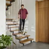A man is cleaning stairs with a floor cleaner. Anteprima dell’immagine prodotto
