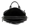 A black leather briefcase is shown open from the top, against a white background. Produktbild-Vorschau
