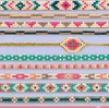 A collection of colorful beaded bracelets arranged horizontally against a light purple background. Podgląd zdjęcia produktu