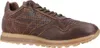 A single brown leather sneaker is shown against a white background. Voir les images du produit