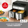 A dual-chamber air fryer with food in the chambers and on plates next to it, with promotional text at the bottom. Produktbild-Vorschau