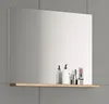 A frameless mirror with a wooden shelf mounted on a gray tiled wall. Several cosmetic items are placed on the shelf. Produktbild-Vorschau