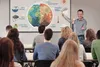 A teacher presents a diagram about the Earth's environment to a classroom of students. Náhled obrázku produktu