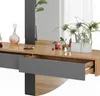 A close-up view of a modern vanity table with drawers and a mirror, decorated with plants and makeup. Produktbild-Vorschau