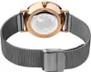 The back of a rose gold and gray Bering watch with a mesh strap. Náhled obrázku produktu