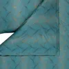 A close-up view of teal-colored fabric with a wavy pattern in gold. Produktbild-Vorschau