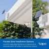 Two views of a white outdoor security camera with a solar panel attached, mounted on a white overhang. The bottom of the image has a blue background with text and a logo. Podgląd zdjęcia produktu