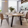 A dining table with chairs in a well-lit dining room with a view of hills outside the window. Voir les images du produit