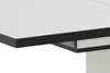 Close-up of the edge of a white table with a black trim. Produktbild-Vorschau
