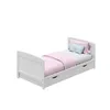A white baby bed with pink and blue bedding, shown from a slightly elevated side angle against a white background. Produktbild-Vorschau