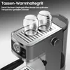 A close-up view of an espresso machine with two glass cups on its warming plate. Produktbild-Vorschau