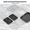 A collection of kitchen accessories, including racks and trays, arranged on a wavy, light-colored surface. Produktbild-Vorschau