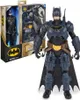 A Batman action figure is displayed next to its packaging. Produktbild-Vorschau