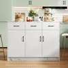 A kitchen island with drawers and cabinets, decorated with a vase of flowers and a coffee machine. Voir les images du produit