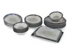A collection of ceramic dishes, including plates and bowls, arranged on a white background. Produktbild-Vorschau
