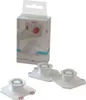 A product shot of three white plastic docking accessories and their packaging. Produktbild-Vorschau
