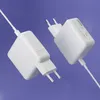 Two white power adapters are shown against a purple background. Podgląd zdjęcia produktu