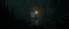 A person holding a torch in a dark cave. Produktbild-Vorschau