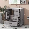 A bathroom vanity with an open door and drawers, showcasing storage and a sink. Anteprima dell’immagine prodotto