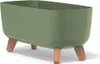 A green planter with wooden legs on a white background. Produktbild-Vorschau