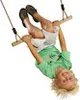 A child is upside down on a wooden swing. Anteprima dell’immagine prodotto