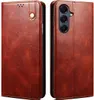 A brown leather flip case for a smartphone is shown from two angles. Produktbild-Vorschau
