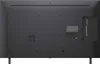 The back of a television with various ports and labels. Voir les images du produit