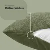 Close-up of a green pillow showing a zipper detail. Produktbild-Vorschau