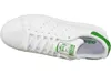 A top-down view of a white Adidas Stan Smith sneaker with green accents. Náhled obrázku produktu