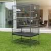 A large metal bird cage with two parrots inside, placed on a green lawn in front of a modern house. Produktbild-Vorschau