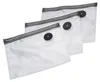 Three clear vacuum seal bags are stacked diagonally against a white background. Each bag has a black valve on its surface and a grey zipper closure. Podgląd zdjęcia produktu