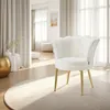 A white fluffy armchair with gold legs is placed on a cream rug in a bright, airy room with sheer curtains. Produktbild-Vorschau