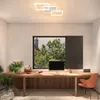 A modern home office setup with a desk, computer, and a window overlooking trees. Produktbild-Vorschau