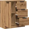 A close-up shot of a wooden cabinet with one door open, revealing multiple drawers. Anteprima dell’immagine prodotto