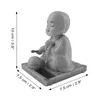 A solar-powered wackelfigur (wobble figure) of a meditating monk. Produktbild-Vorschau