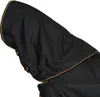 Close-up of a black horse blanket with gold trim and a hood. Voir les images du produit