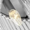 A close-up view of a light bulb in a modern fixture with crystal accents. Produktbild-Vorschau