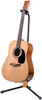 An acoustic guitar on a stand against a white background. Produktbild-Vorschau