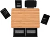 A top-down view of a bamboo cutting board with black drawers and containers. Produktbild-Vorschau