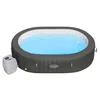 An oval-shaped inflatable hot tub filled with blue water, with a white control unit attached to the side. Produktbild-Vorschau